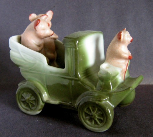 This motor coach complete with driver and 2 cutes pigs sold on ebay for $73. Rare.