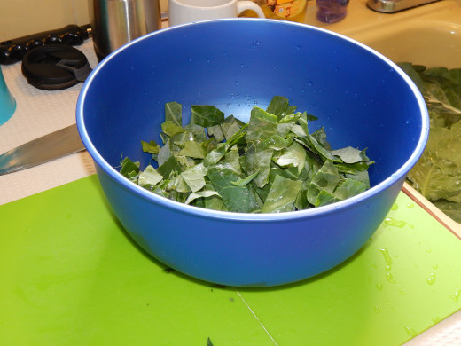 blue bowl of collard greens in strips
