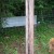 Wrapped telephone pole with fencing Wrapped telephone pole with fencing