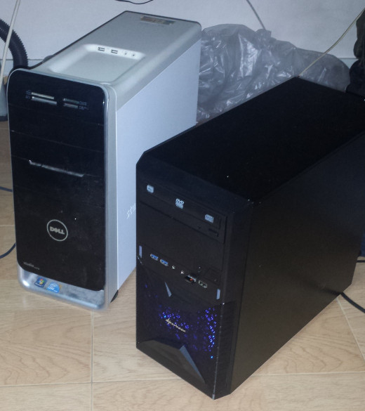 My old Dell desktop tower (left) transplated into a brand new Sharkoon case (right).