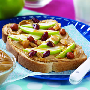 Open Face Peanut Butter Sandwich. The sandwich has peanut butter, apple slices and raisins and your kids will love it. 