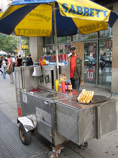 Hot Dog Cart in a location which would potentially get a lot of pedestrian traffic. 