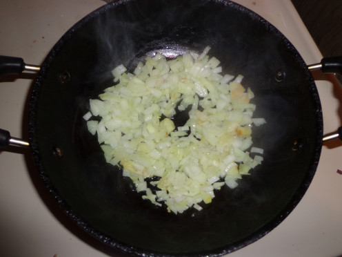 Onions are added in the pan for frying