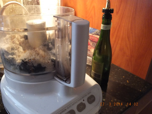 Attach the lid to your food processor and start the machine. Drizzle the 2/3 cup oil in through the food chute.