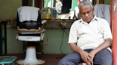 Old hairdresser sleeping at work