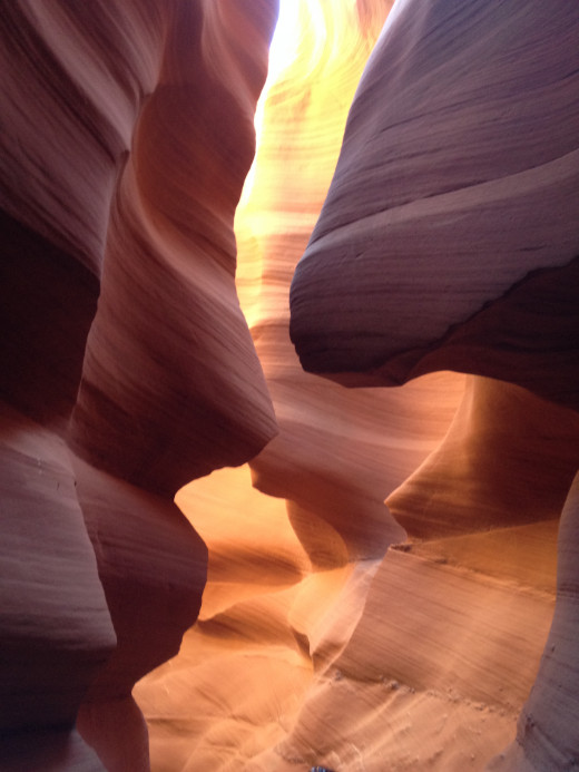 Millions of years of water periodically rushing through the canyon have resulted in the elegantly carved rock in Antelope Canyon