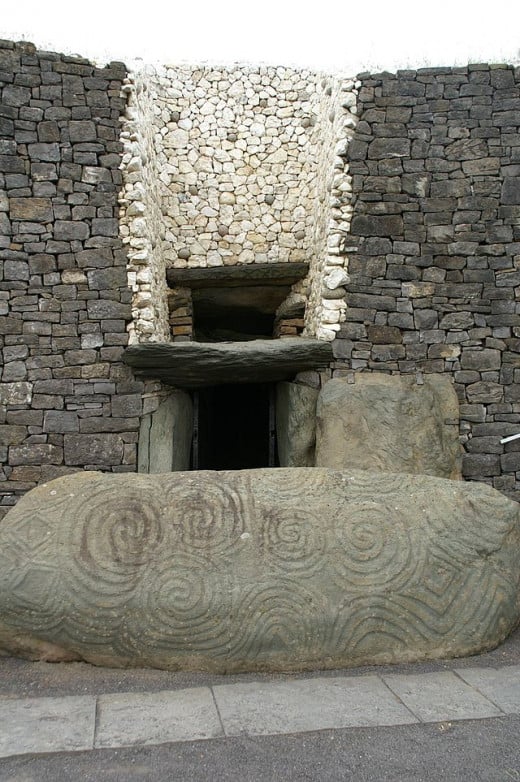 Entryway to Newgrange as it appears today, after restoration. Photo by user Christof Berger on Wiki Commons.