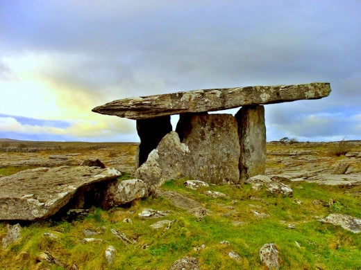 Dolmens are one type of chamber tomb. Usually a large flat stone placed like a roof atop other megaliths which act as walls, thereby creating a chamber within. This is the Poulnabrone dolmen, located in Co. Clare, Ireland. Photo by Steve Ford Elliot