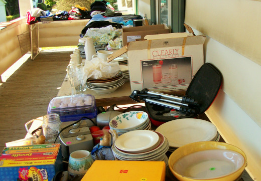 Display of dishes and other popular items placed on table for sale.