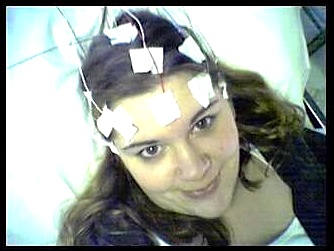 Electrodes are attached to the part of the body being tested with EEG (electroencephalography).  It is non-invasive can be made portable.