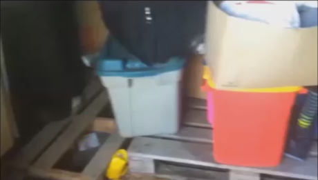 Put the pallets down on the ground side by side and stack your plastic totes on top of them.