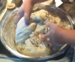 Lift the dough form the edge of the mixing bowl and pull it into the center and push it down. Then turn the mixing bowl and repeat the process.