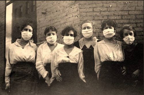 Women in the early 20th century aiming to prevent the Spanish Flu.