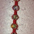 Continue adding a series of beads and knots until you have used all 9 beads. Continue adding a series of beads and knots until you have used all 9 beads.
