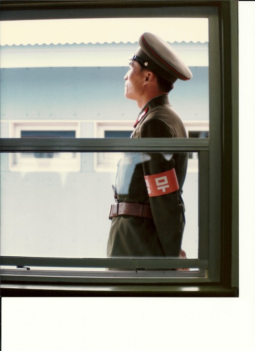 A North Korean soldier at Panmunjom.  The Armband indicates he is on duty. 1985.