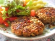 Pumkin-seed crusted lentil patties with roasted garlic mashed potato and salad