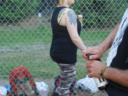 This is a missed shot.  I believe it was Norman who was opening beer bottles with his belt buckle.  I was focusing on that, which is why I accidentally cut off Lindsey's head (great tattoo she has!)