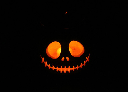 A grinning Jack O'Lantern is a traditional design. This one is particularly stunning. One of the best carved pumpkins I've seen in the traditional designs!