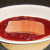 Salmon fillet is laid in raspberry marinade