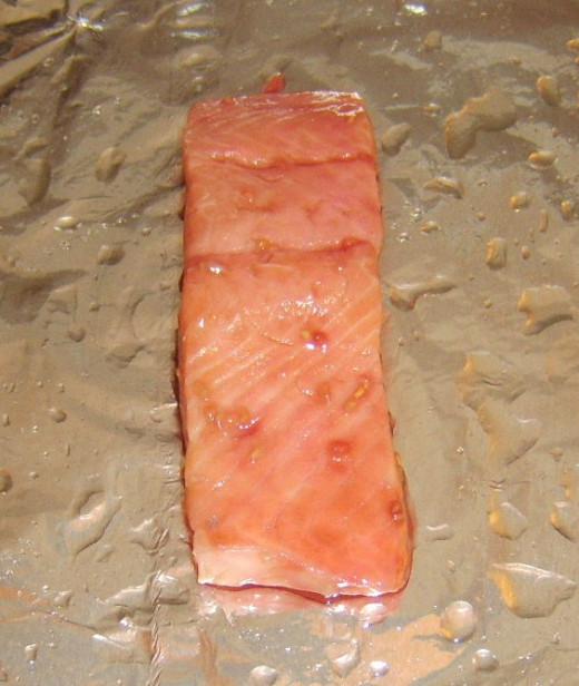 Preparing to broil (grill) marinated salmon