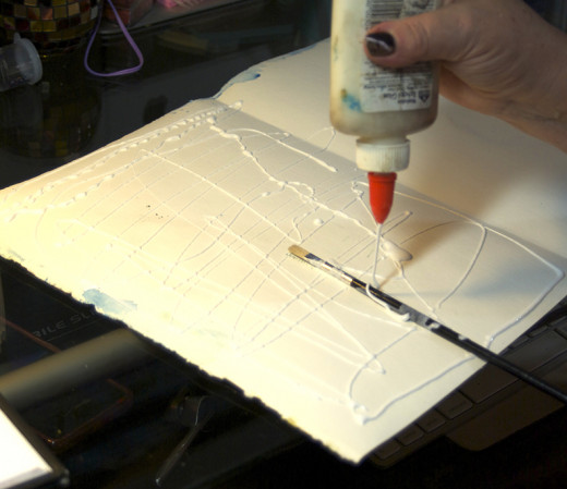 Open and add glue and long-handle paintbrush.