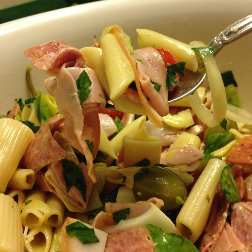 Assorted cured meats, pickles, vegetables from the garden plus pasta.