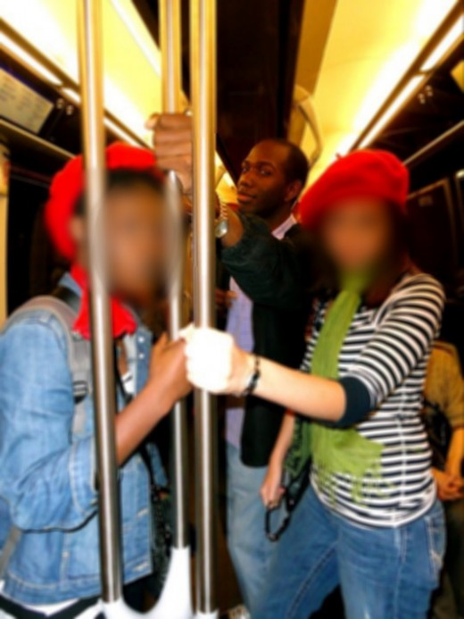 Riding the French Metro and wearing stereotypical red berets