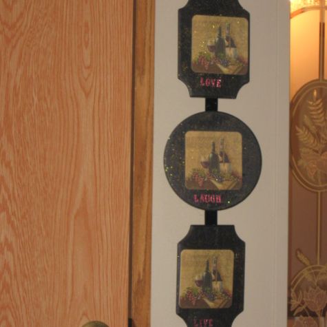The three DIY plaques connected and hanging on the wall.