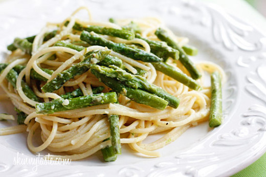 Simple spaghetti noodles topped with asparagus and parmesan cheese.