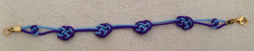 Coin knot bracelet, which is too light to wear without pulling the knots out.