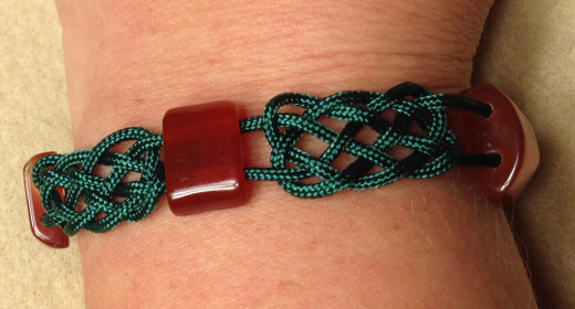 Prosperity knot bracelet in which the prosperity knots haven't been tightened enough.