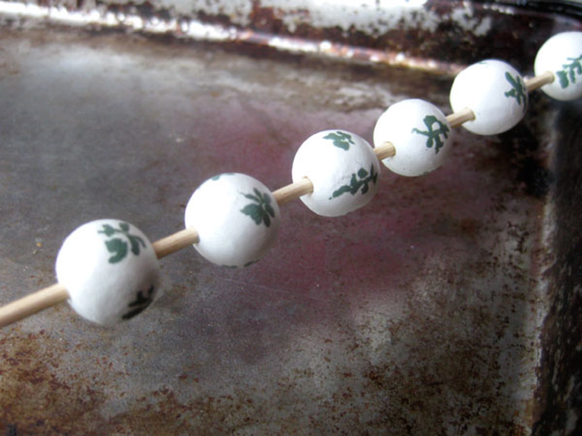 Twist the beads onto a kebab stick in batches of similar sizes for baking.