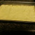 Crescent rolls pressed into greased  pan.