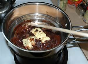 Melt Chocolate and Margarine in double boiler.