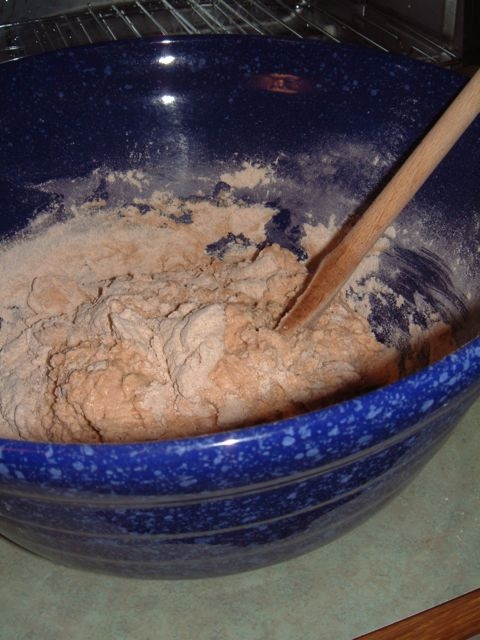 Mixing the flour(s), salt, water and yeast.