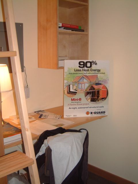 A built-in desk adjacent the ladder.