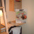 A built-in desk adjacent the ladder.