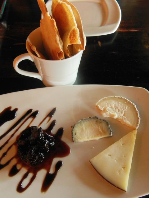 Here is a trio of cheese, paired with some simple crackers and a fancy drizzle of balsamic reduction.