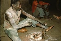 A voodoo practitioner conducting a ritual
