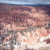 Snow and trees decorate the hoodoos.
