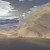 Ghost Mountains - Someone figured out how to do overhangs, and taught the rest of us. You make the terrain high by multiplying height a couple of times. You render at .1 pixel height instead of the normal 1. It produces this effect. The surface is a 