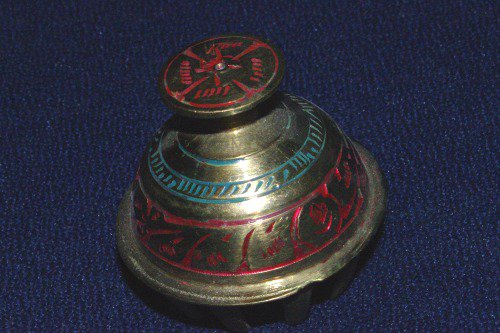Brass bell with painted decorations