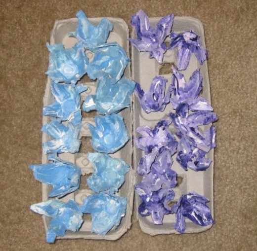 Finished egg carton flowers ready to be strung on a light strand.