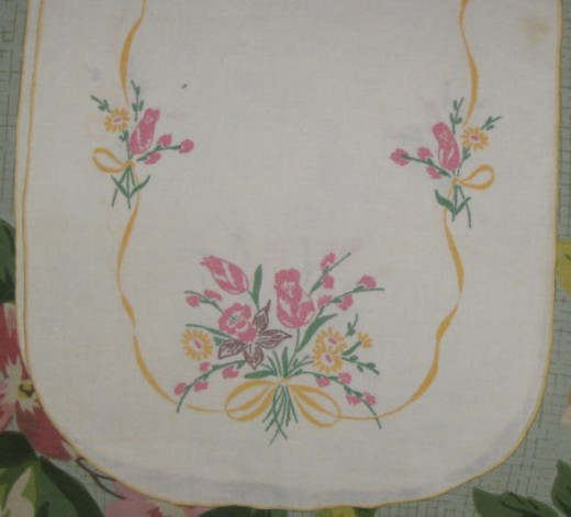 Paint embroidery on a long table runner.