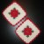 Pair of vintage potholders with red flowers. Pair of vintage potholders with red flowers.