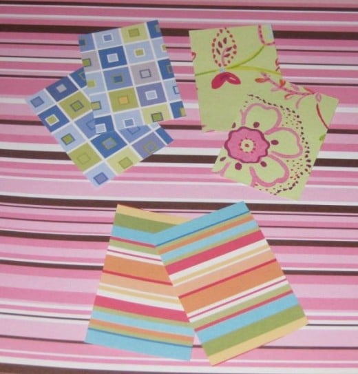 Cut out scrapbook paper using the top and bottom of the matchbox as a template.
