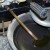 Put an oil pan under the other end of the plastic tube then twist and pull the drain valve.The cold oil will start to drain in the pan slowly. Put an oil pan under the other end of the plastic tube then twist and pull the drain valve.The cold oil will start to drain in the pan slowly.