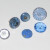 These blue buttons are all shank buttons except the little flat 2-hole glass button on the right front of the photo. His motto:  "It's perfectly clear. Glass is better."