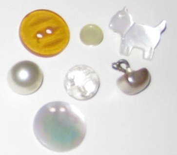 Decorative white buttons. Is that cat button one of the cutest buttons or what?