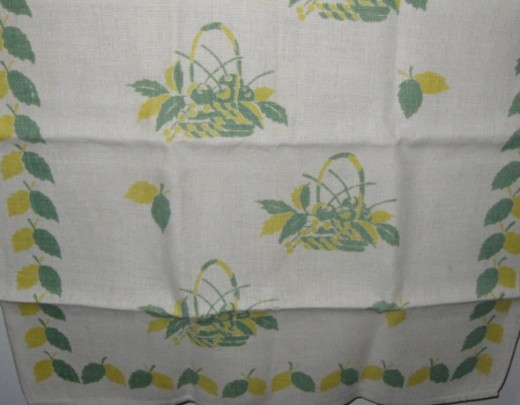 Baskets with fruit on linen tea towel.